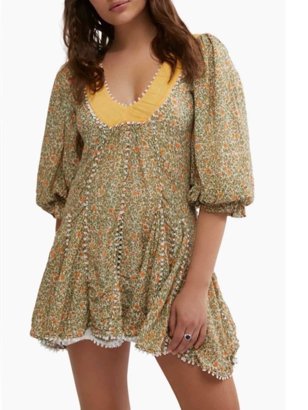 Free People Bali Coral Mini Dress features a ditsy floral print and a V-neckline